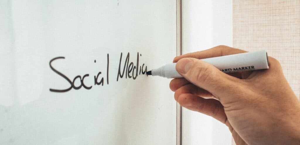 photo of social media being written in marker on a white board